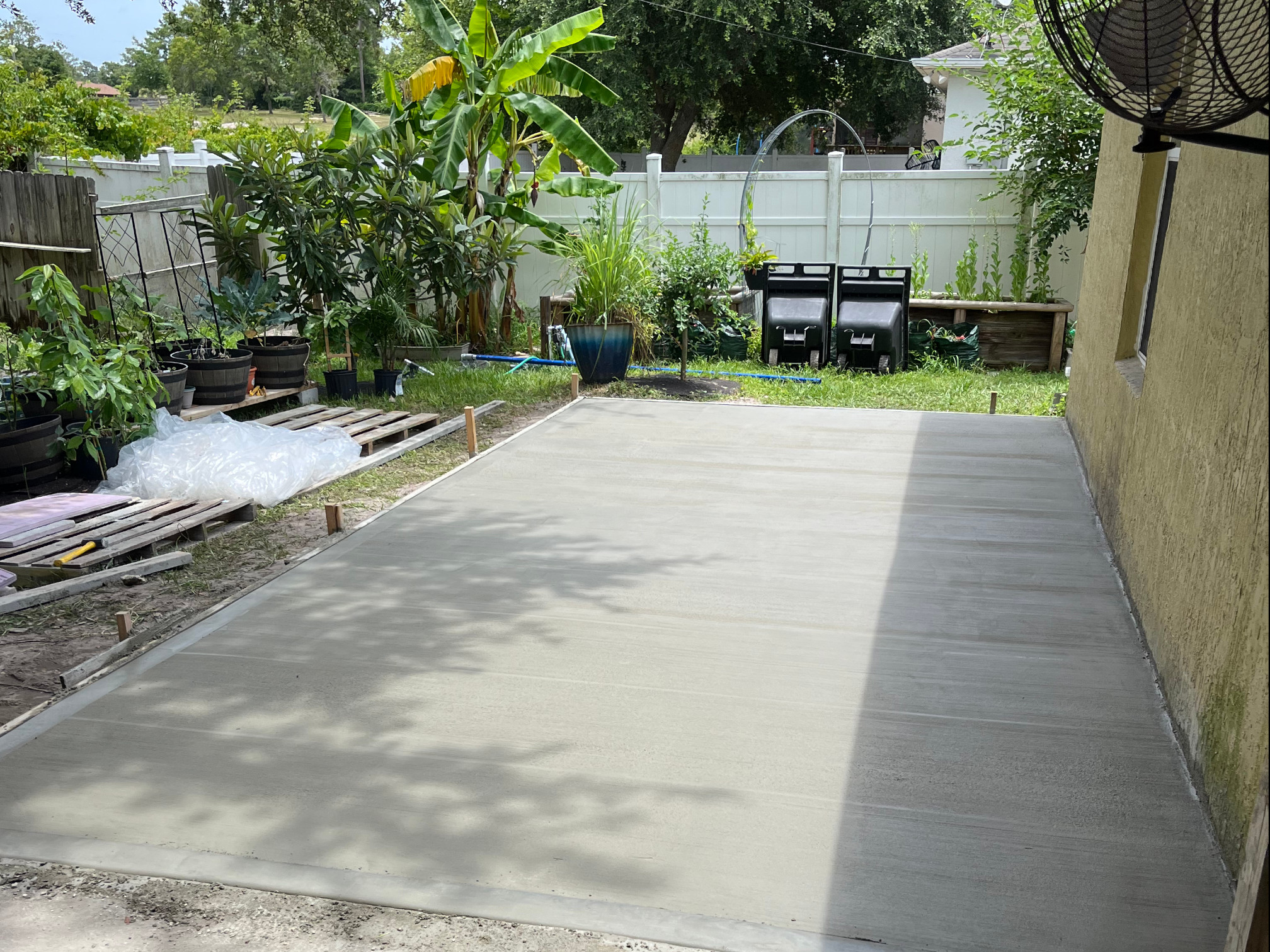 Fresh concrete slab installed in a Central Florida backyard by Tobinator Services